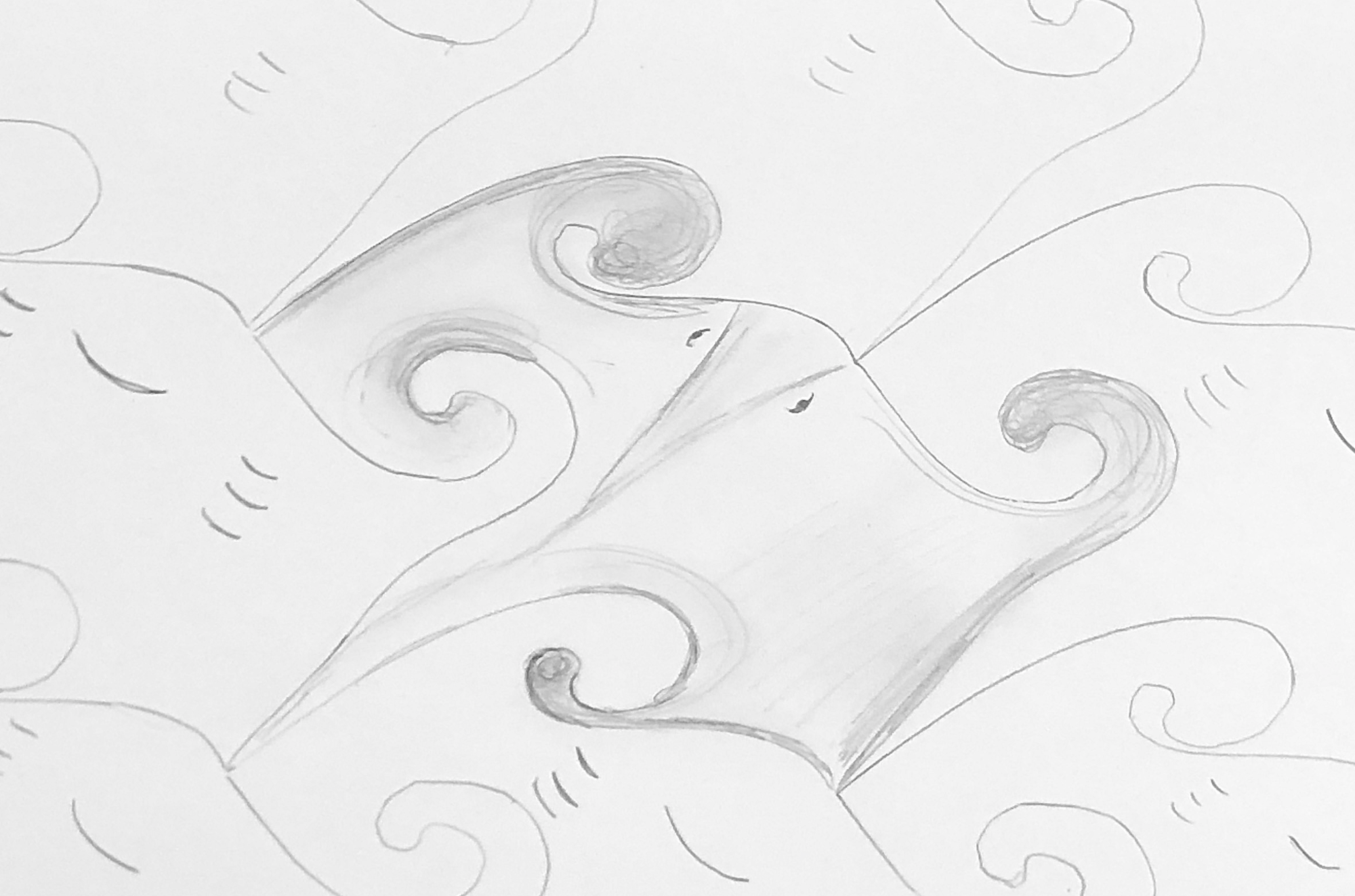 a tessellation of a stingray with spirals with pencil and paper