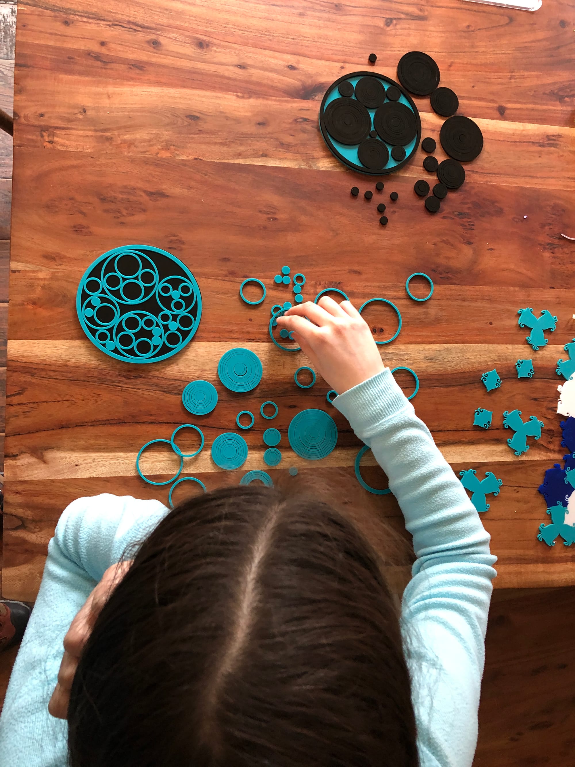 A student playing with circles