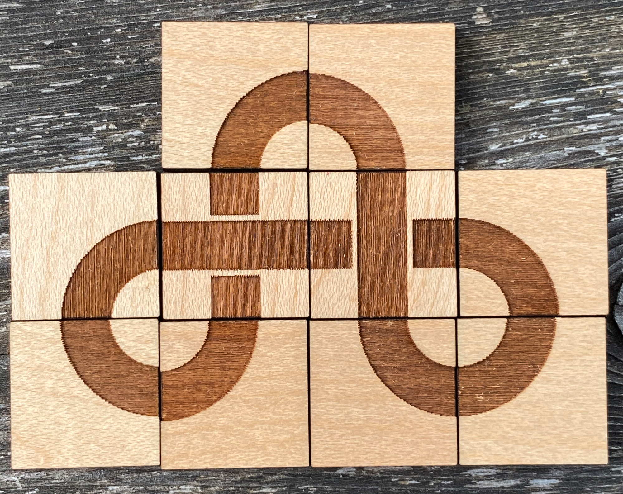 truchet tiles making a trefoil knot made of wood (laser cut)