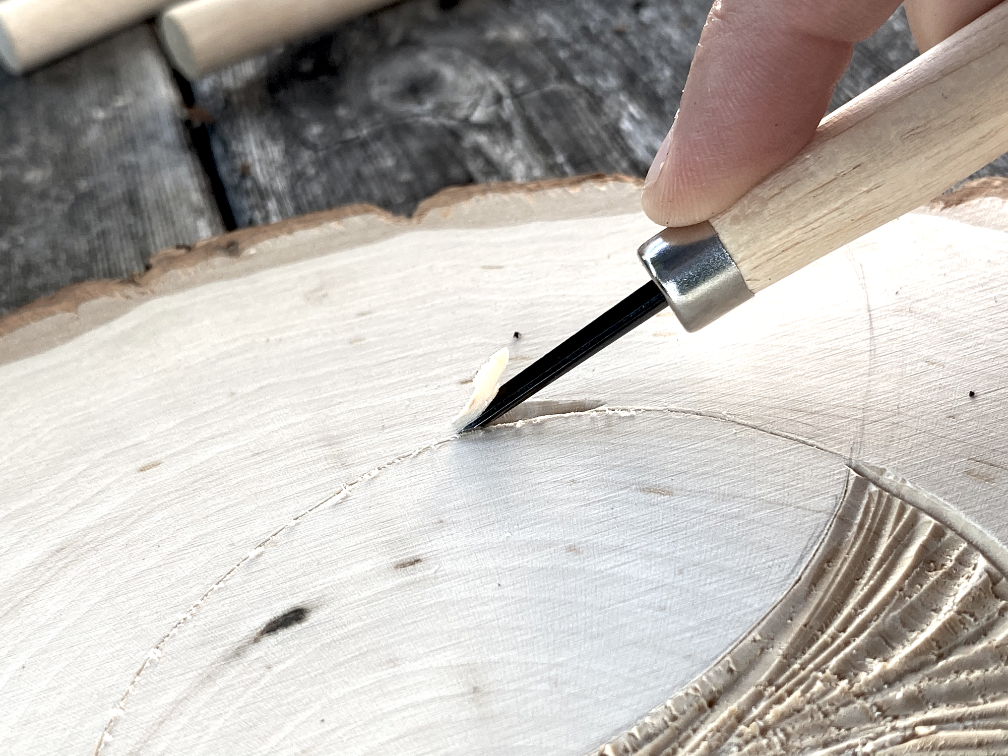 wood getting cut by a tool showing the circle