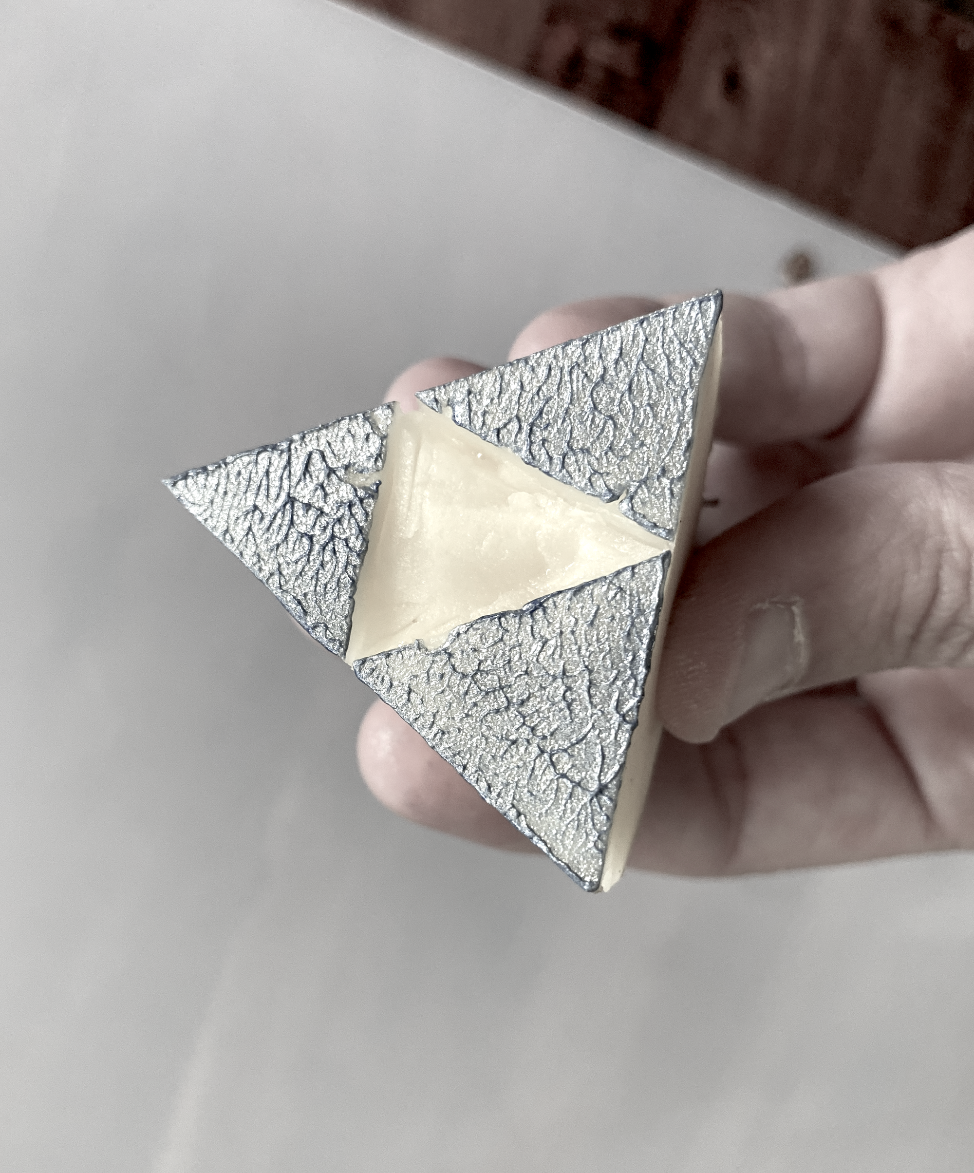 a triangle stamp made from a potato